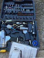 Full view of the Mastercraft pneumatic tool set inside a molded carrying case showing four main air tools, sockets, attachments, and accessories.