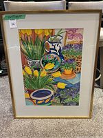 Full front view of framed watercolor painting under glass, showing mat and gold-tone wood frame.