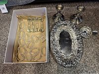 Full lot overview including crystal napkin rings, silver tray, candle holders, and wine tasting glass on carpeted floor.