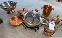 Overhead view of all six copper items arranged on floor