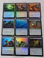 Photo showing nine Magic: The Gathering holo/foil cards with Japanese text and various creature illustrations in a 3x3 grid.
