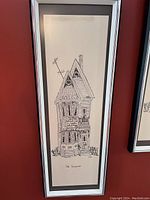 Front view of one framed lithograph print showing detailed pen and ink drawing of a house with peaked roofs and detailed windows and door, titled 'Old Vancouver'.