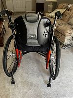 Front view of JAY J3 wheelchair showing backrest label and red frame.