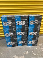 9 boxes stacked showing the front labels of the 4 inch LED recessed lighting packs.