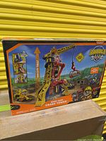 Front image of unopened Rubble & Crew Bark Yard Crane Tower toy box showing product artwork and set height.