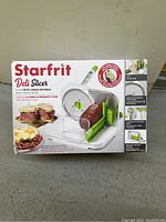 Box front of Starfrit deli slicer showing product image and features