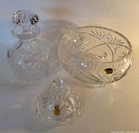 Overall set of 3 vintage crystal pieces on white background showing patina and condition