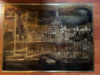 Full view of brass etching showing entire scene with boats and buildings.