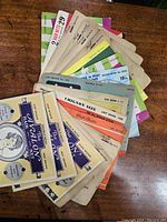 Top view showing assortment of vintage hair net packages in fan arrangement highlighting multiple brands and colors.