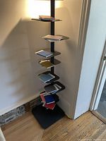 Front view of the shelf displaying color swatch books on each tier, showing overall height and configuration.