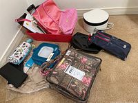 Overview of the assorted makeup and travel cases showing various colors and materials.