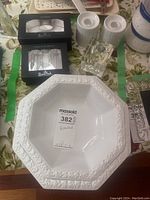 White octagonal porcelain dish with embossed floral border, Rosenthal brand tag visible