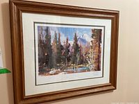 Framed nature themed print with visible wooden frame and glass front