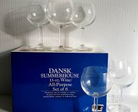 Six clear glass wine goblets displayed with original blue box labeled DANSK Summerhouse 13 oz Wine All-Purpose Set of 6.