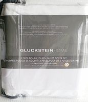 Front packaging label showing brand Glucksteinhome, product description as 3 piece double/queen duvet cover set, 625 thread count, 100% Egyptian cotton satin, Gold Seal Certified.
