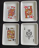 Six rectangular ceramic snack dishes showing playing card face illustrations including Jack of Diamonds, Queen of Hearts, King of Clubs, Ace of Spades. Dishes show slight use signs.
