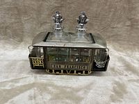 Front angled view of San Francisco trolley car decanter set showing both decanters, shot glasses, and trolley details