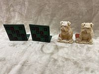 Front view of two pairs of bookends: bulldog shaped pair and checkerboard patterned pair