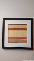 Framed limited edition print by Benjamin Arnot, showing horizontal abstract bands in warm tones with signature and numbering bottom corners.
