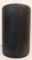 Black cylindrical Mid-Century Modern up lamp with white interior, showing surface wear and black finish.