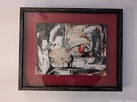 Framed mixed media collage artwork showing full piece in custom shadow box frame with red matte background.