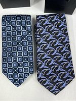 Two Robert Talbot men's neckties side by side, showing patterns and colors.