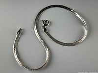 Full length photo of the sterling silver bracelet showing the entire chain and clasp.