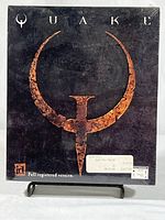 Front view of Quake PC game sealed box showing large logo and label with 'Full registered version' text.