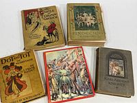 Five vintage children's books arranged on a white surface, titles visible with worn covers