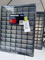 Two sealed Mastercraft parts cabinets with 60 clear drawers each, black frame, in original shrink wrap.