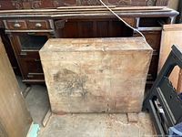 Butcher block top 40" wide x 31" deep x 12.5" tall leaning against cabinet