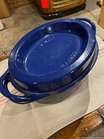 Oval roaster with lid on – exterior view showing shape and small chip on lid side