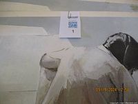 Close-up of the upper back and head area of figure in print to show detail and watermark.