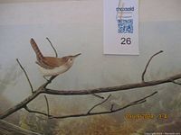Photo showing the bird print on cardboard mounted with matting.
