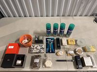 Full overview of all items on table including perfume, soaps, razors, and grooming products.