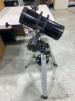 Telescope fully assembled on tripod showing optical tube, mount and support