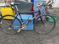 Full side view of the purple Trek Multitrack bicycle showing aluminum frame, tires, pedals, and seat.