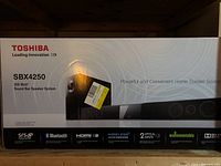Front of Toshiba SBX4250 sound bar speaker system box showing branding, model, and features