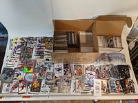 Overview of two boxes and loose cards spread on table