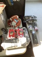 Image showing the 20-can cooler bag, two footballs, red and white Coors Light socks, and some caps.