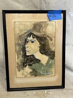 Full view of the framed watercolor painting showing a woman in profile.
