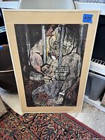 Full front view of the framed artwork showing the entire piece with the mat and frame.