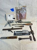 Full lot overview showing all vintage woodworking hand tools including boxed Sears hand saw set, files, hand planes, protractor, hammer.