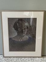 Front view of the framed original self portrait artwork in charcoal and pastel by Kate Jackson showing detail and framing.