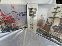 Front view of two sealed model ship kits in original boxes: La Reale de France and Frigate USS United States