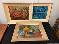 Group photo of three paintings including two framed Darcy signed oils and one unsigned oil on board. Frames show wear.