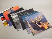 Seven vintage rock vinyl albums with front covers visible, includes multiple Supertramp and The Police albums.