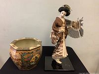 Photo showing both the Satsuma planter pot and the Geisha figurine together, presenting overall size and condition.