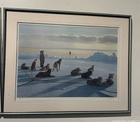 Framed numbered print art showing sled dogs on snowy terrain with icy mountains in the background under cloudy sky.
