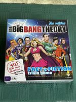 Front cover of the trivia game box, featuring cartoon superhero versions of The Big Bang Theory characters with details about 400 new trivia questions.